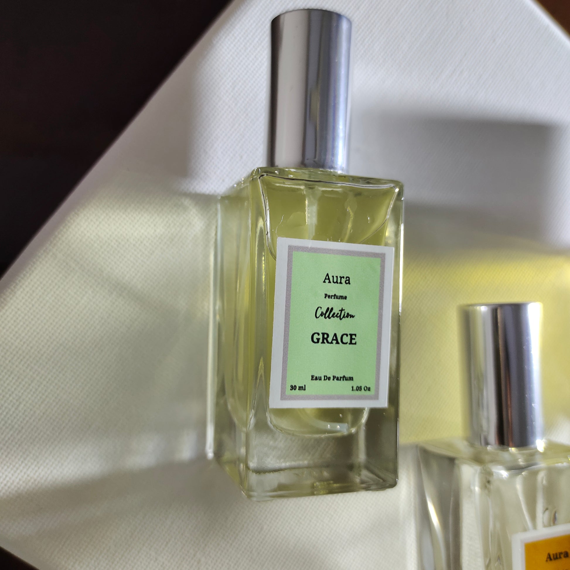 perfume with notes of fresh flowers and rich woods in a refined glass bottle.